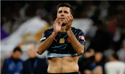  ?? Tuesday. Photograph: Juan Medina/Reuters ?? Rodri applauds Manchester City’s travelling fans following their Champions League quarter-final first leg at the Santiago Bernabéu on