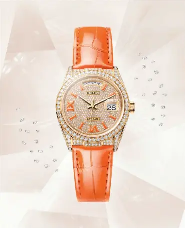  ??  ?? Oyster Perpetual Day-Date 36 in 18 ct yellow gold and diamonds
with a coral-coloured leather strap and matching appliques