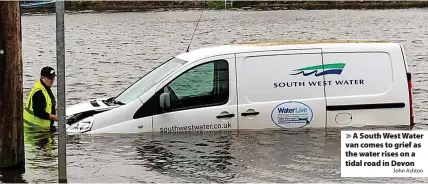  ?? John Ashton ?? A South West Water van comes to grief as the water rises on a tidal road in Devon