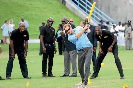  ?? PHOTO: REUTERS ?? Prince Harry and cricketers Andy Roberts, Vivian Richards and Curtly Ambrose attend a youth sports festival at Sir Vivian Richards Stadium showcasing Antigua and Barbuda’s national sports.