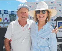  ?? Picture: MIKE BATTERHAM ?? Gerry Harvey and Katie Page at the Magic Millions Barrier Draw at Surfers Paradise.