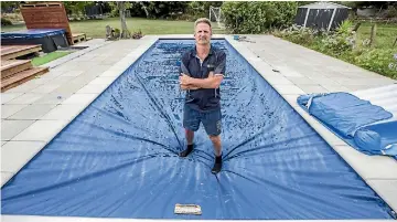  ?? PHOTO: RICKY WILSON/ STUFF ?? Swimming pool owner Warren Cairns, of Blenheim, says electric pool covers might actually be safer than fences.
