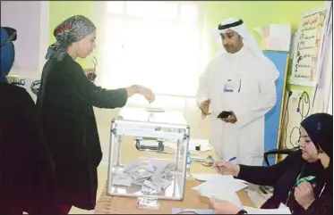  ?? Photo by Mahmoud Jadeed ?? A woman casts her vote in the Third Constituen­cy by-election held Saturday.