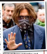  ??  ?? Masked: Depp yesterday and, right, a photo of Ms Heard ‘with two black eyes’ shown in court