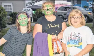  ?? CHRISTIAN ROACH/CAPE BRETON POST ?? Sara Pope, from left, Eva Barnstable and Haivyn Fortune pose at the Louisbourg Street Dance on Saturday.