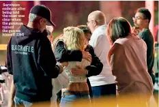  ??  ?? Survivors embrace after being told the coast was clear when the gunman turned the gun on himself (DM)