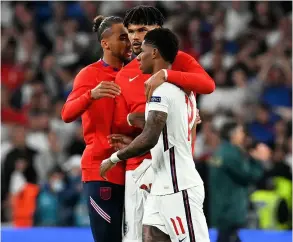  ?? PICTURE: Paul Ellis/pool/getty Images ?? Tyrone Mings consoles Marcus Rashford after missing his penalty