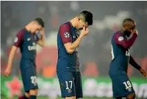  ?? PHOTOS: GETTY IMAGES ?? Above, Yuri Berchiche and his PSG team-mates look dejected after the Champions League loss in Paris to Real Madrid, for whom Casemiro and Cristiano Ronaldo, below, celebrate a goal.
