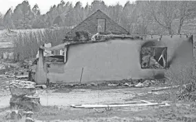  ?? LUIS SANCHEZ SATURNO/THE NEW MEXICAN VIA AP ?? A burnt home following a wildfire is seen in Sapello, New Mexico, on Tuesday.