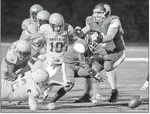  ?? Arkansas Democrat-Gazette/MITCHELL PE MASILUN ?? Sylvan Hills running back Deon Youngblood (7) fumbles after he is hit by Pulaski Academy defensive tackle Ephraim Su (62) on Friday at Sylvan Hills High School in Sherwood.