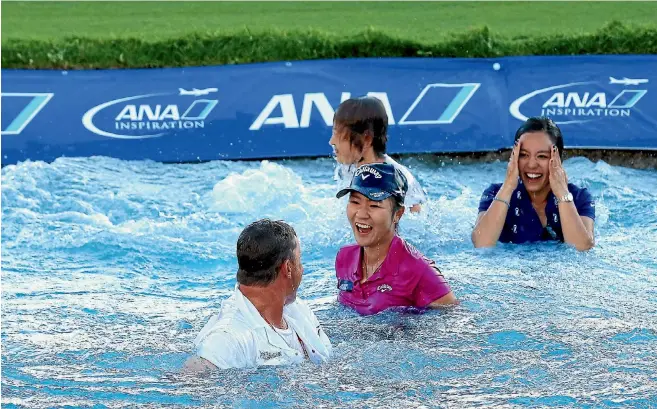  ?? GETTY IMAGES ?? Lydia Ko, then caddie Jason Hamilton, her sister Sura and mother Tina Hyon after leaping into Poppie’s Pond when she won the ANA Inspiratio­n in California in April.