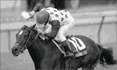  ?? KEVIN SHORT ?? Miesque’s Approval, a son of Win Approval, wins the 2006 Breeders’ Cup Mile at 24-1.