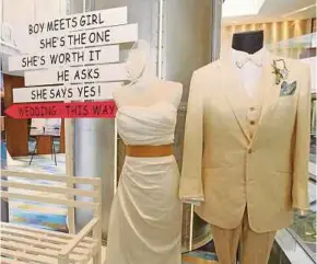  ?? FILE PIC ?? Wedding costumes on display at Starwood Malaysia Wedding Fair in 2014. Career-driven single women should not give in to peer pressure to get married.