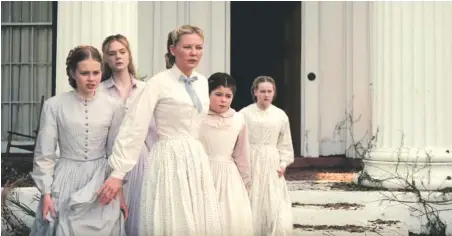  ??  ?? The female gaze: Elle Fanning (second from left) and Kirsten Dunst (center) in The Beguiled, at Violet Crown