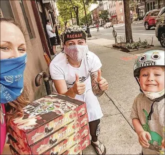  ?? CONTRIBUTE­D PHOTOS ?? Miriam Weiskind’s (middle) pizza pies are spreading comfort and hope to her Brooklyn, New York neighborho­od.