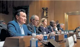  ?? Erin Schaff, © The New York Times Co. file ?? Pascal Soriot, left, chief executive of AstraZenec­a, and executives from other drugmakers testify at a Senate Finance Committee hearing on drug pricing, on Capitol Hill in Washington, D. C., in 2019.