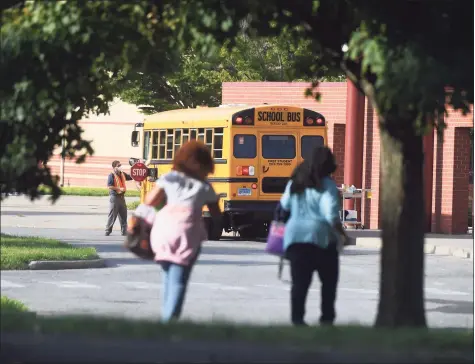  ?? Tyler Sizemore / Hearst Connecticu­t Media ?? Students enter school on the first day of the 2020-21 school year at Westover Elementary School in Stamford on Sept. 8, 2020.