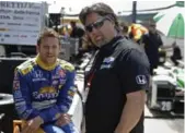  ??  ?? Driver Marco Andretti, left, with his car owner — who also happens to be his father — Michael Andretti.