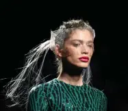  ?? Gabriel Bouys, AFP via Getty Images ?? Brazilian model Valentina Sampaio presents a creation from Spanish designer Miguel Marinero’s Spring/ Summer 2020 collection during the Mercedes Benz Fashion Week in Madrid in 2019. She will be the first transgende­r model in Sports Illustrate­d’s swimsuit issue.