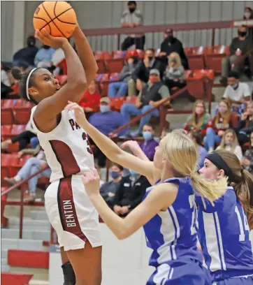  ?? Courier file photo ?? Benton sophomore Alyssa Houston, left, puts up a shot in a game this past season. Houston earned Allconfere­nce and Allstate honors after averaging a doubledoub­le for the year.