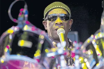  ??  ?? BELOW
Tony Allen plays Glastonbur­y in England, in 2010.