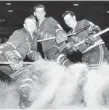  ?? GAZETTE FILES ?? Pentti Lund, right, pictured with New York Rangers teammates Ed Slowinski and Don Raleigh in 1950.