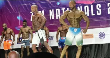  ?? ?? PASSING . . . Blessing “CC Banks” Sithole (third from left) and David Weier (right) flex their muscles on stage
OF THE TORCH during last weekend’s Zimbabwe National Bodybuildi­ng Competitio­n in Harare