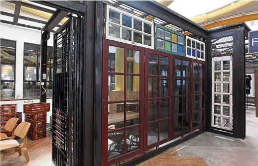  ?? — Photos: KAMARUL ARIFFIN/The Star ?? Wooden door and window frames, salvaged from old houses and shophouses in Selangor and Melaka, have been reused to frame the retail lots at Commune.