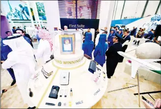  ?? (AFP) ?? People visit the Saudi Arabian Airlines stand during the Arabian Travel Market 2017 (ATM) at the Dubai World
Trade Centre on April 24.