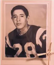  ?? COURTESY OF THE ESQUIBEL FAMILY ?? Salomon Esquibel, an athlete in several sports and roles, is shown in his high school football days.