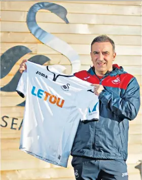  ??  ?? Top job: Carlos Carvalhal says his new role at Swansea City appealed to his ‘romantic side’