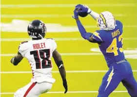  ?? ASHLEY LANDIS AP ?? An intercepti­on, the Chargers’ third of the game, by cornerback Michael Davis late in the fourth quarter led to Michael Badgley’s game-winning field goal against Atlanta.