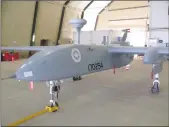  ?? Canadian Press photo ?? A Heron pilotless spy drone, operated by the Canadian military, sits in a hangar at Kandahar Airfield in 2010.