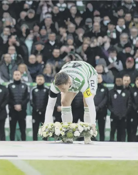  ?? ?? 2 Aberdeen captain Scott Brown, left, and Celtic skipper Callum Mcgregor lay wreaths in tribute to Lisbon Lion Bertie Auld. Mcgregor would go on to score a fortuitous winner for Celtic while Brown was forced off with an injury