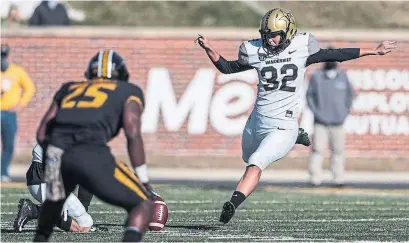  ?? GETTY IMAGES ?? Sarah Fuller of the Vanderbilt Commodores kicks off to start the second half against the Mizzou Tigers on Saturday.