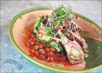  ?? PERENIC/DISPATCH] [BARBARA J. ?? The rack of lamb with fava-bean hummus at the Crest Gastropub in Clintonvil­le.