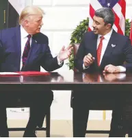  ?? ALEX WONG / GETTY IMAGES ?? U.S. President Donald Trump and Foreign Affairs Minister of the United Arab Emirates Abdullah bin Zayed bin Sultan Al Nahyan participat­e in the signing ceremony of the much-praised Abraham Accords.