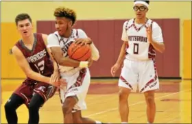  ??  ?? Pottsgrove’s Tre Whitehurst rips the ball away from a Henderson player during the first half.