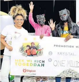  ?? CONTRIBUTE­D ?? Eight-year-old millionair­e Abri (centre) shares the moment with Digicel brand ambassador ZJ Sparks (left) and her mother, Krystal.