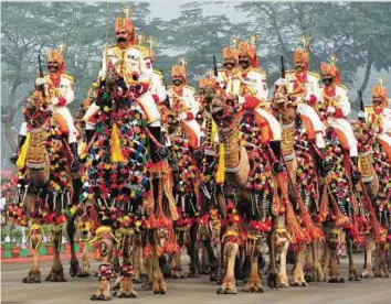  ?? AFP ?? The Indian Border Security Force (BSF) camel contingent marches during the BSF Golden Jubilee Day celebratio­n in New Delhi yesterday.