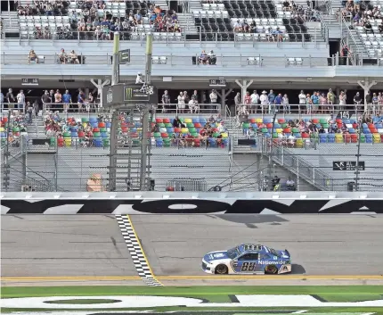  ?? PHOTOS BY JASEN VINLOVE/USA TODAY SPORTS ?? Alex Bowman wins the pole position for the Daytona 500 at Daytona Internatio­nal Speedway driving Dale Earnhardt Jr.’s old car.