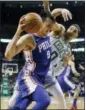  ?? MICHAEL DWYER — THE ASSOCIATED PRESS ?? The 76ers’ Dario Saric (9) drives past the Celtics’ Jayson Tatum (0) during the first quarter of an NBA game in Boston, Thursday.