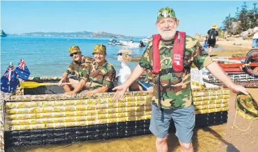  ?? CHEERS: captain Cameron Walker with crew Gary Place, John Murray and John Gill prepare to launch at the Father’s Day Beer Can Regatta on Magnetic Island. Picture: ALIX SWEENEY ?? Dad’s Army