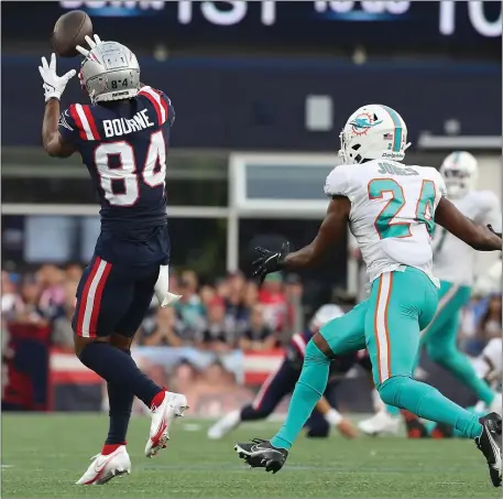  ?? NANCY LANE / HERALD STAFF FILE ?? RARE ROOM TO ROAM: Kendrick Bourne enjoys some cushion while makes a catch against Miami’s Byron Jones in Foxboro last season, an unusual occurrence for Patriots receivers recently, especially against man-to-man coverage.