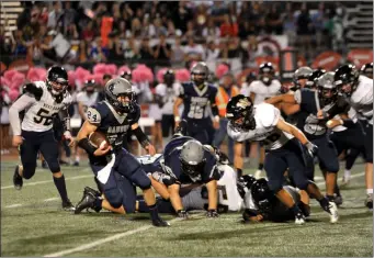  ?? Christian Monterrosa /The Signal ?? (Above) Saugus running back Quinn Sheaffer runs the ball towards the end zone against West Ranch High School in Valencia on Friday. (Below) West Ranch receiver Ryan Camacho follows his blockers and runs down the field on Friday.