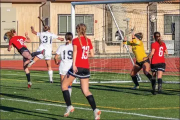  ?? Cory Rubin/The Signal (See additional photos on signalscv.com) ?? Hart’s Alyssa Irwin (16) heads the ball past El Dorado’s goaltender for the game-winning goal in the first round of the CIF-Southern Section Division 1 tournament on Wednesday at Hart.