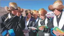  ?? TSERANG YUDRON / XINHUA ?? Villagers read copies of the 2024 Tibetan calendar at the Dakpo astronomic­al observator­y in Maldrogung­kar county, Xizang autonomous region, on March 9.