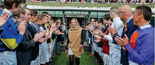  ?? GETTY IMAGES ?? First lady: Josephine Gordon is applauded by her fellow jockeys at Ascot after being named 2016’s top apprentice