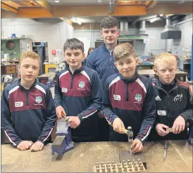  ?? ?? Charlie Dalton, Jack Prendergas­t, Kevin O’Mahony and Jack Clifford give Metalwork a try.