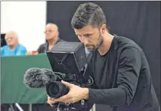  ??  ?? A cameraman with Toronto based Cineflix Media Inc focuses in on a speaker at the Shag Harbour UFO Conference on Aug. 3. The company was in the area filming a documentar­y series called Ocean Mysteries that will focus on the Shag Harbour UFO incident.